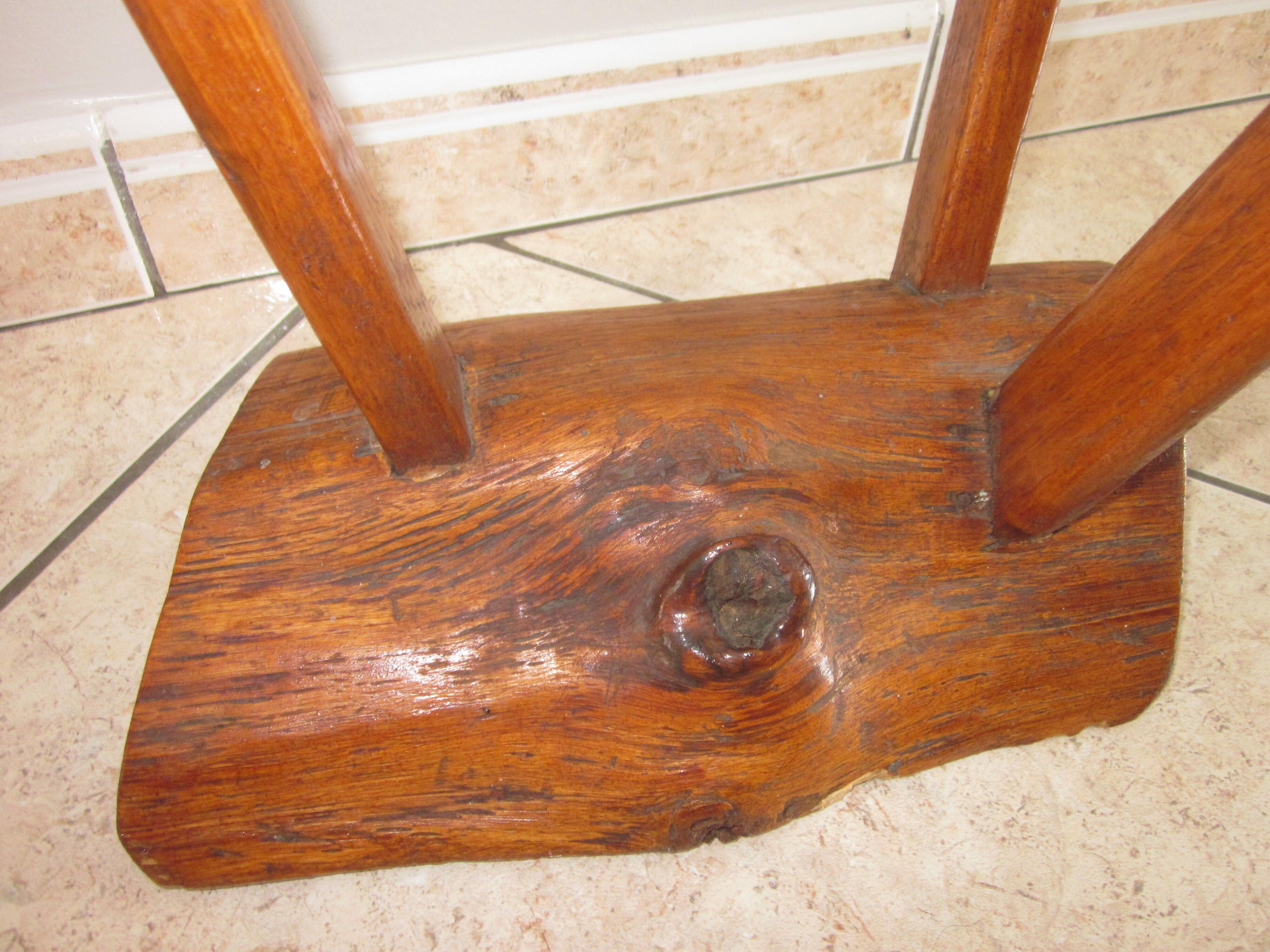 Raw wooden tripod stool