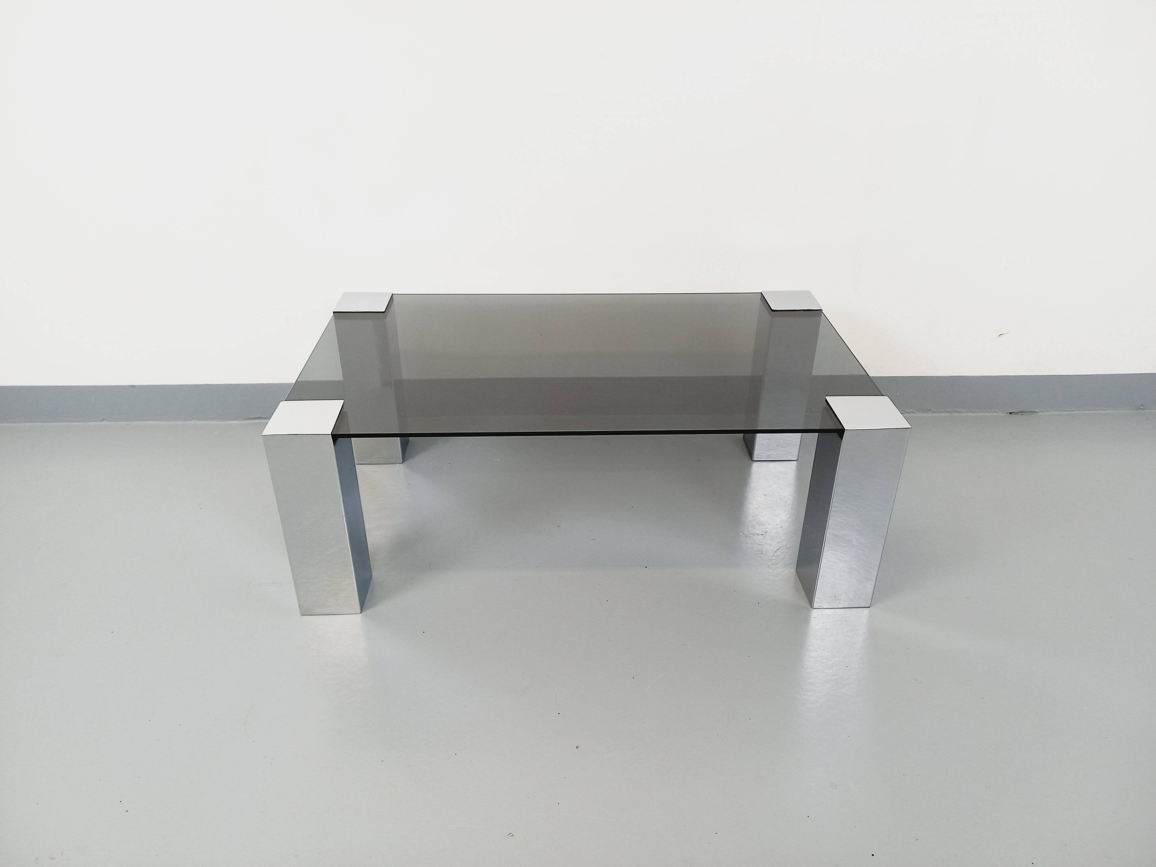 Vintage Italian coffee table Cidue in smoked glass and chrome metal from the 70s