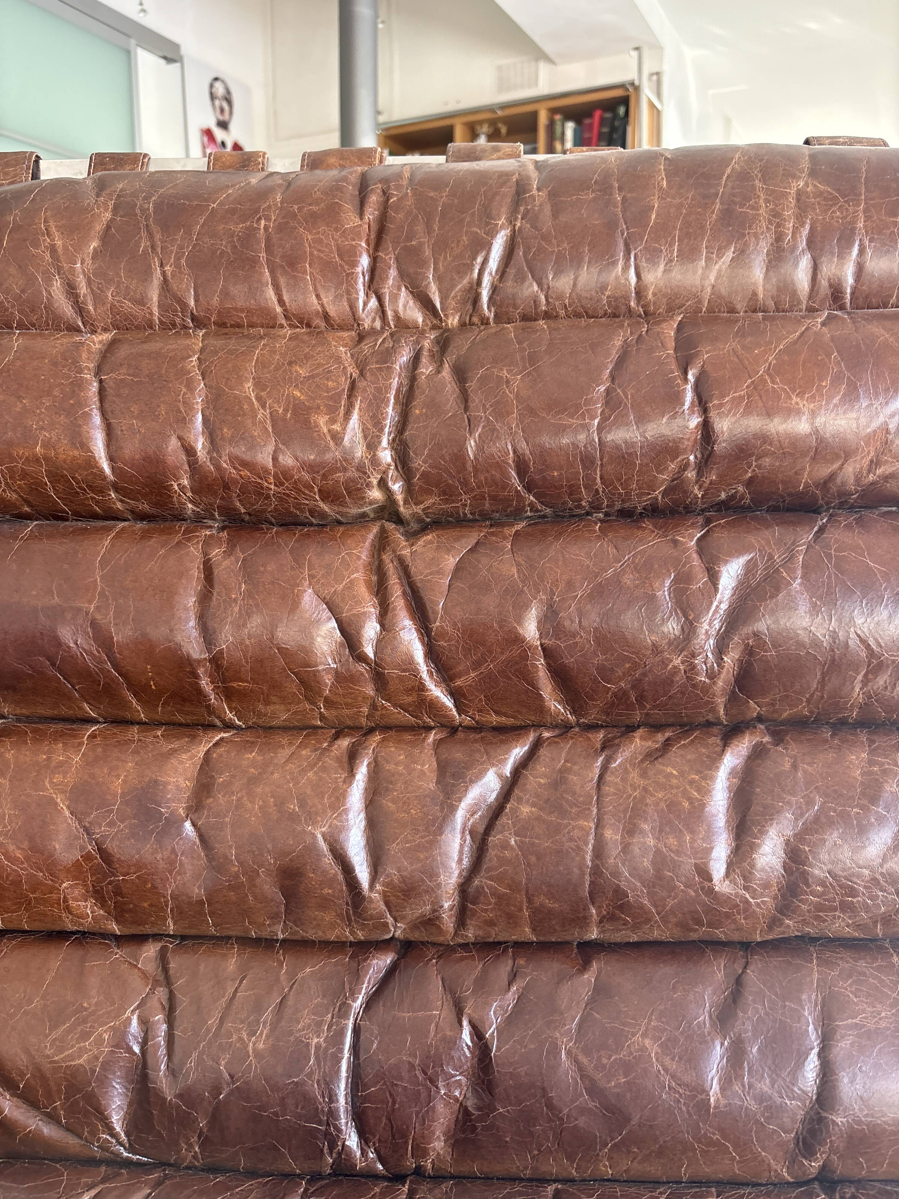 Pair of brown leather armchairs