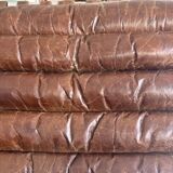 Pair of brown leather armchairs