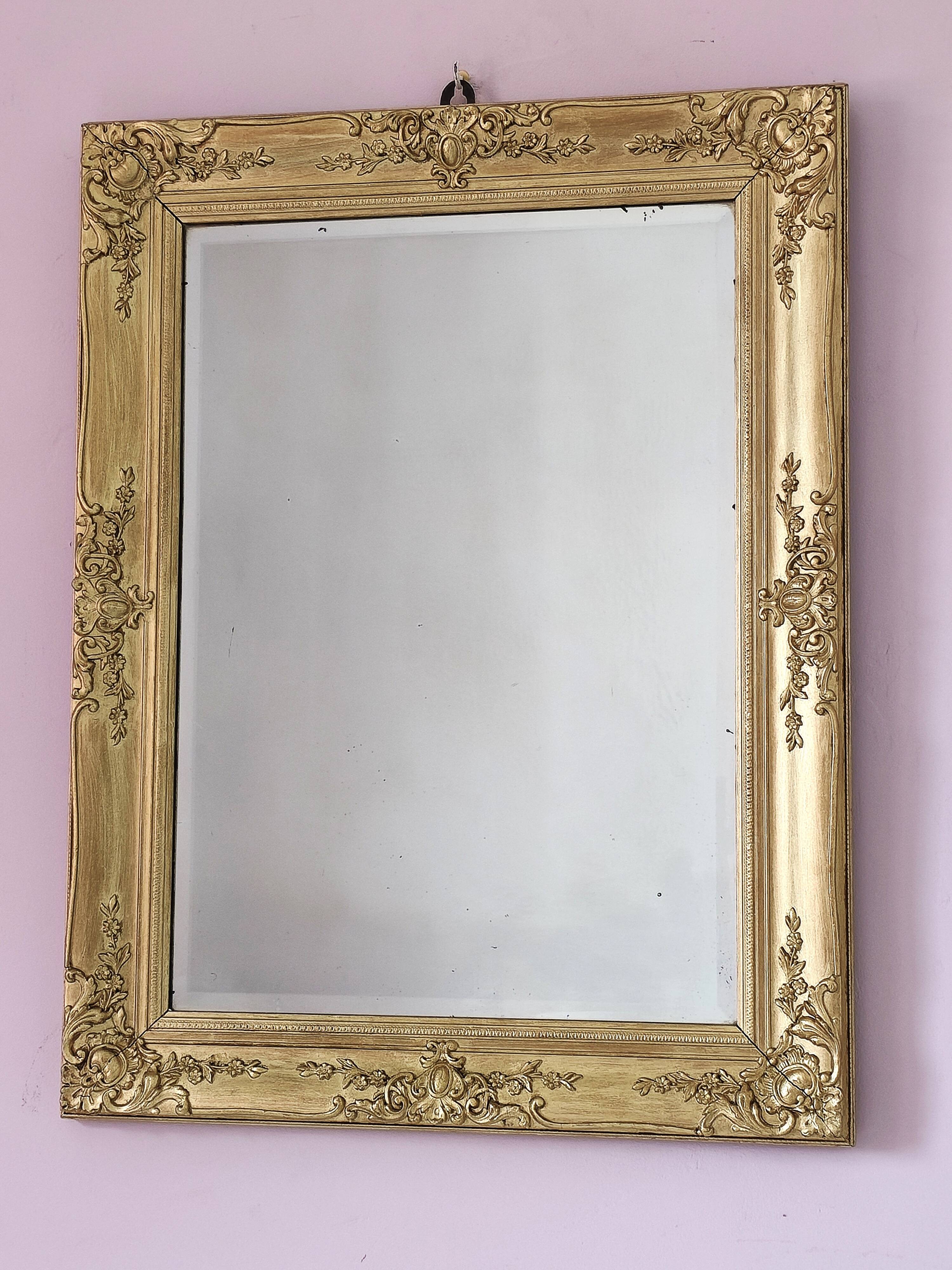 Richly carved antique gilded mirror