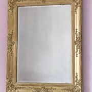 Miroir ancien doré richement sculpté