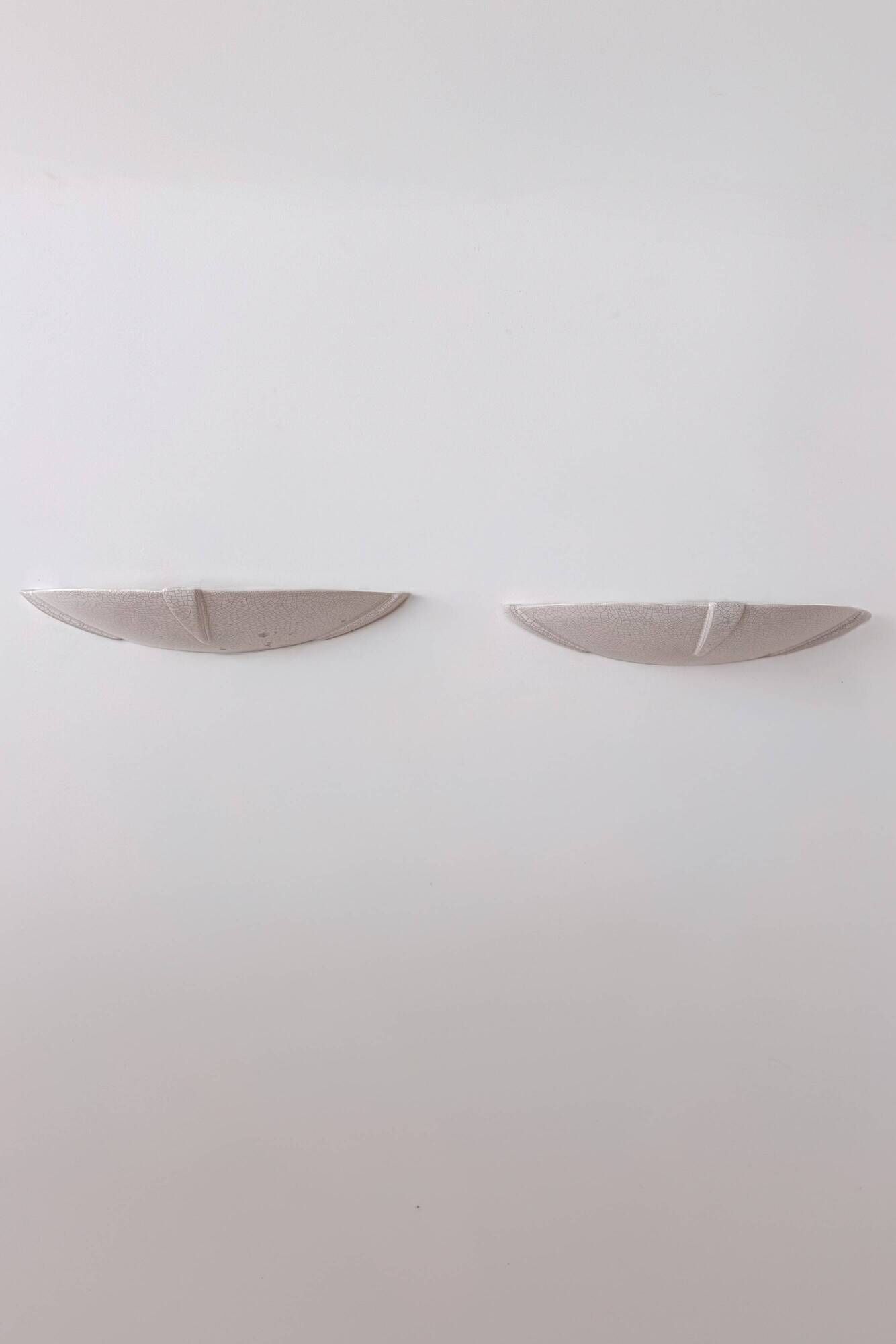 Pair of vintage wall lights in glazed white porcelain, France 1970.