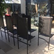 Set of 6 dining room chairs with tripod legs in grained leather and metal 1970