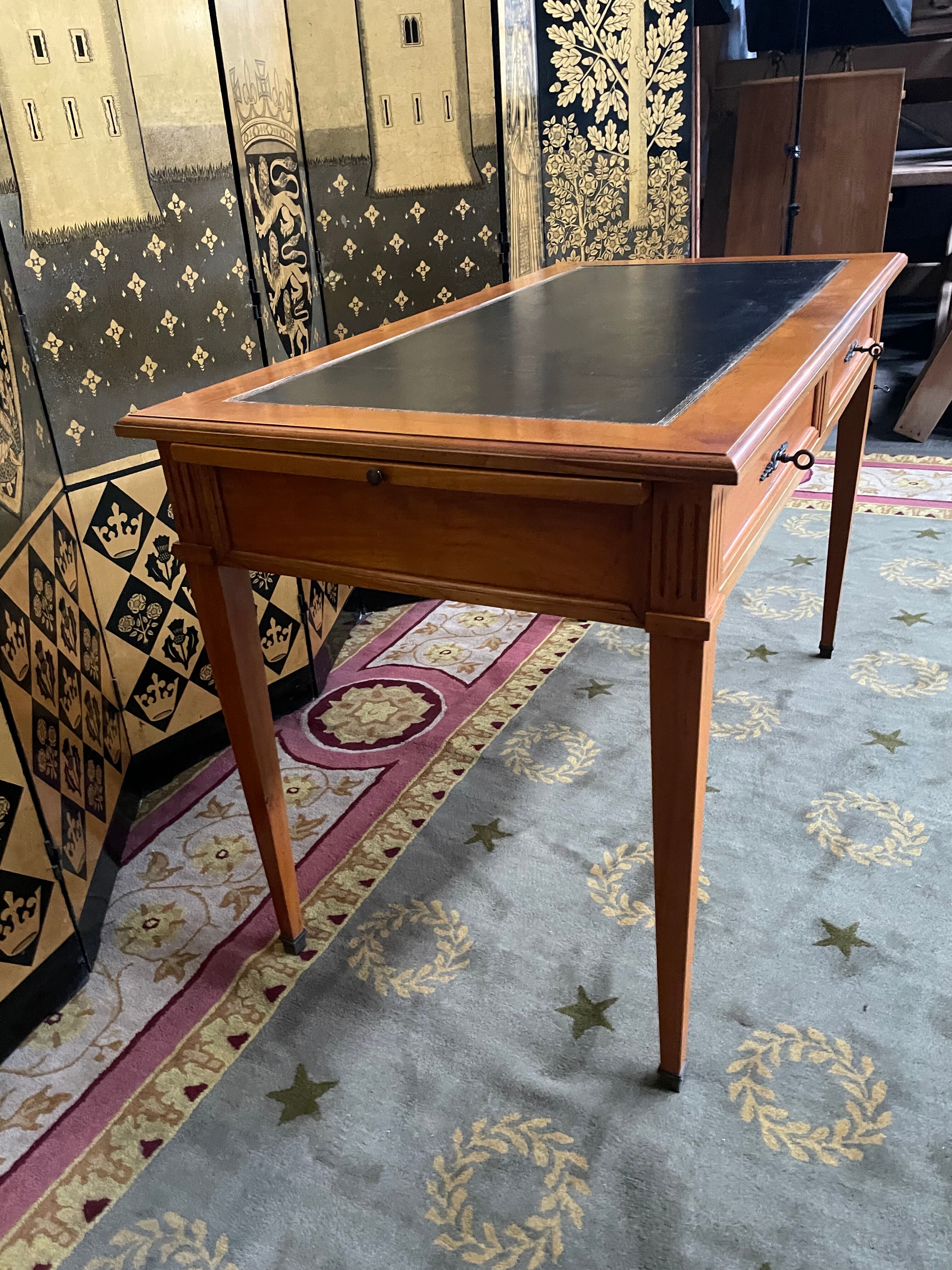 Desk full of Louis XVI style black leather