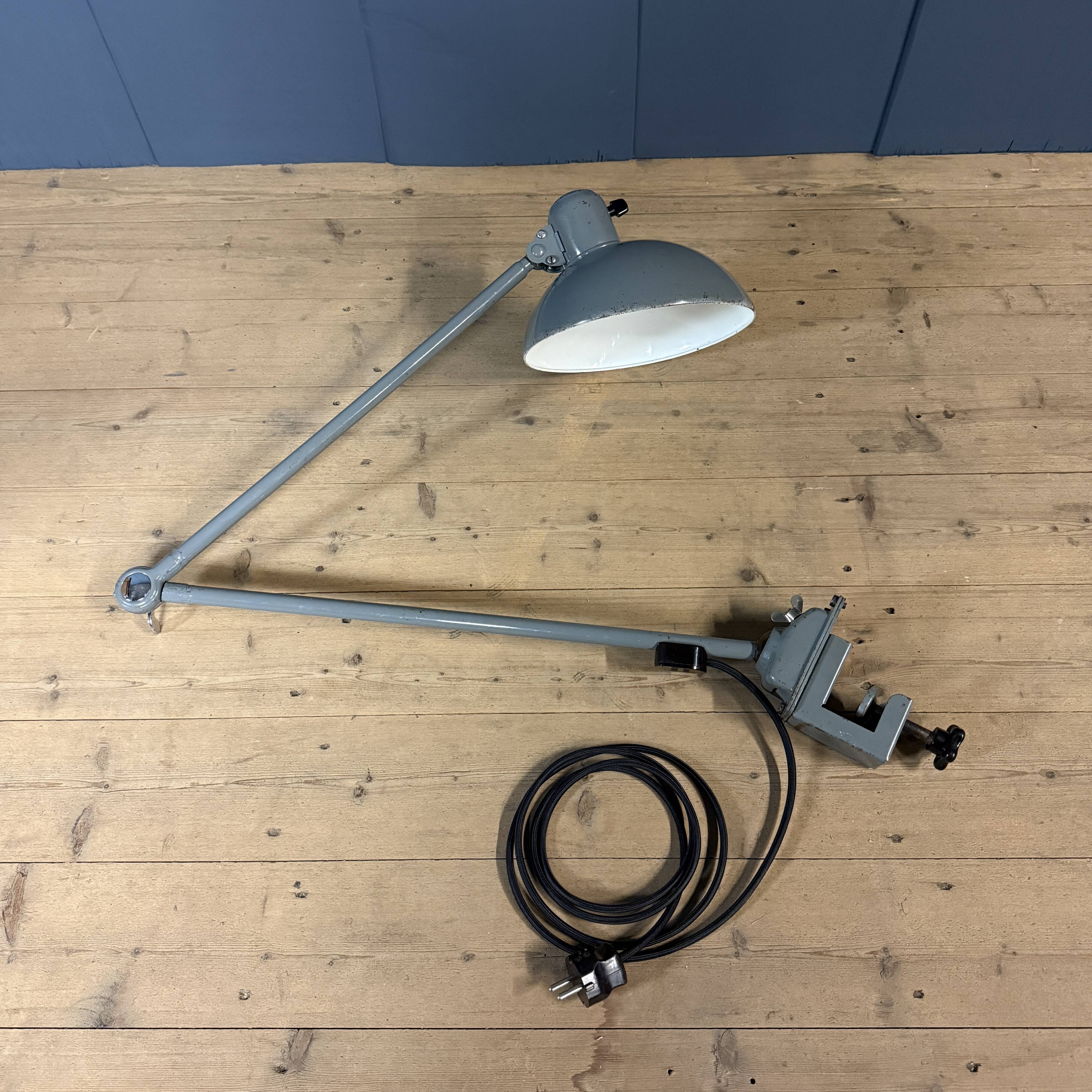 Grey two-arm Kaiser Idell clamp lamp model