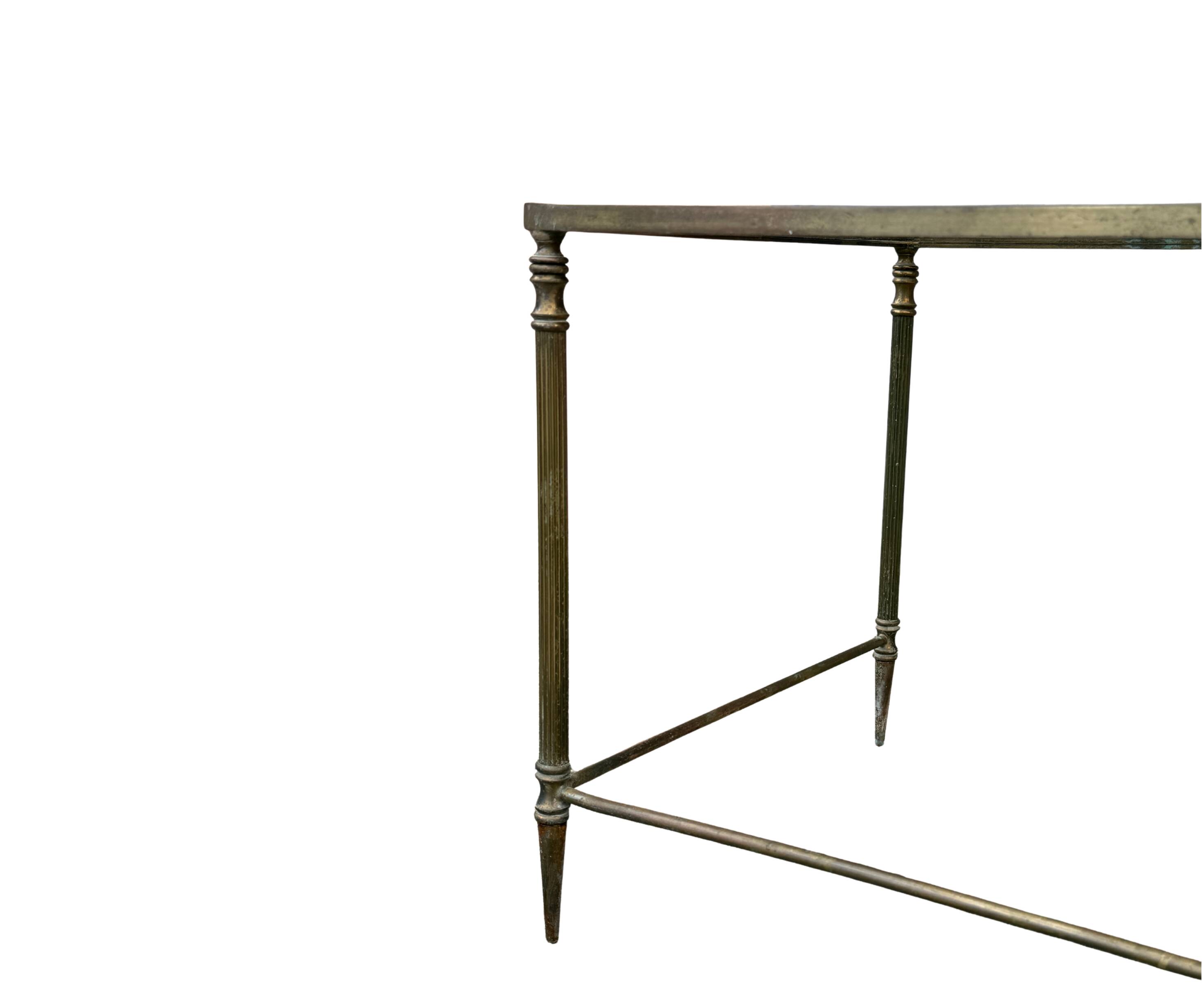 Side table in brass and smoked glass