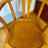 Antique curved wooden armchair in Baumann style