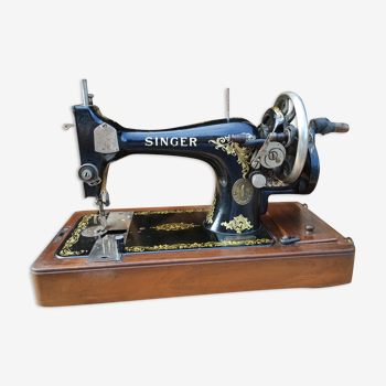 Old Singer sewing machine on its original base