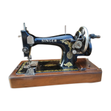 Old Singer sewing machine on its original base