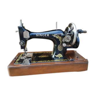 Old Singer sewing machine on its original base