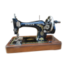 Old Singer sewing machine on its original base