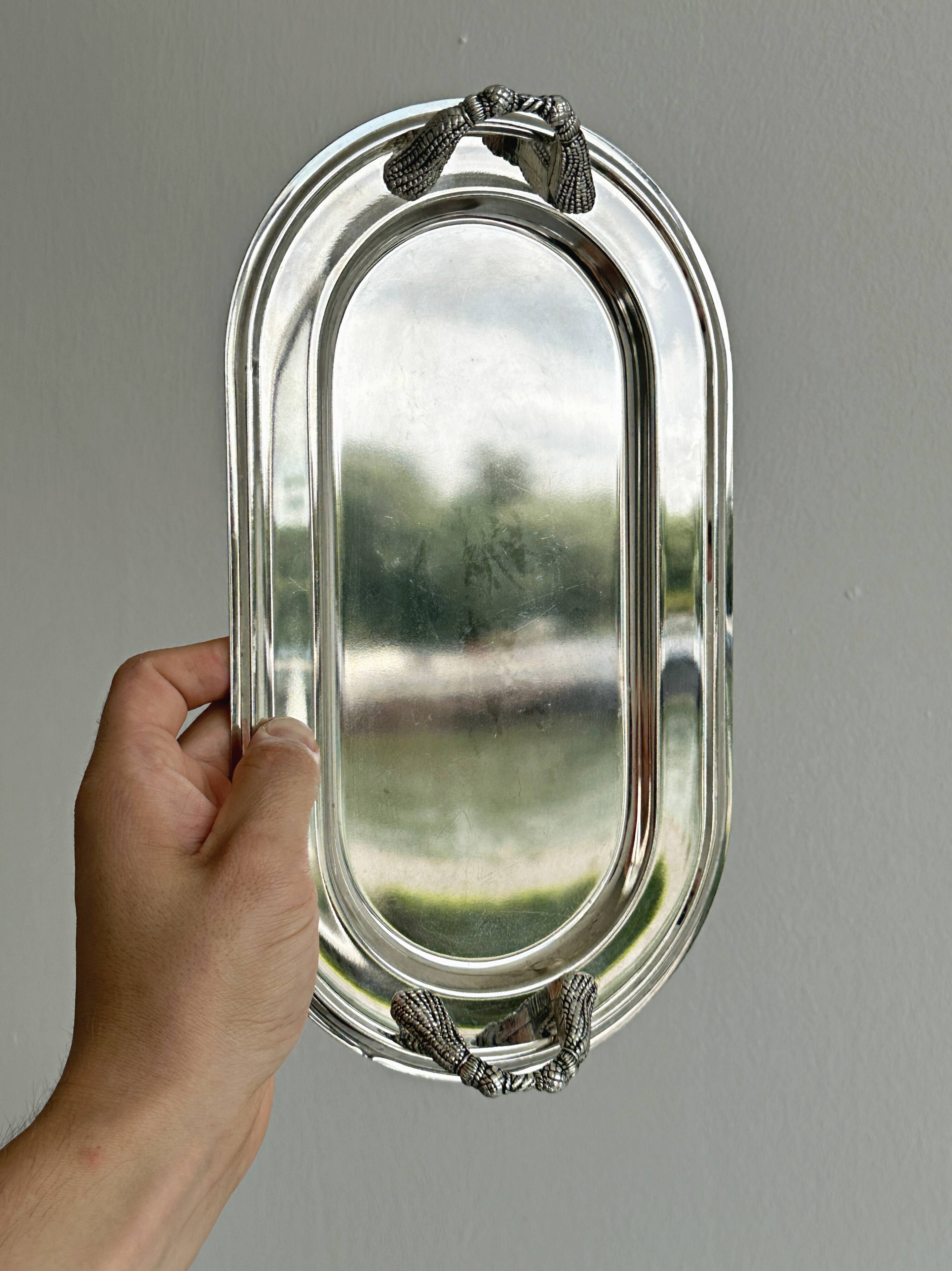 Vintage silver plateau with knot handles.