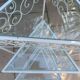3 nesting tables in white wrought iron. Beveled glass.