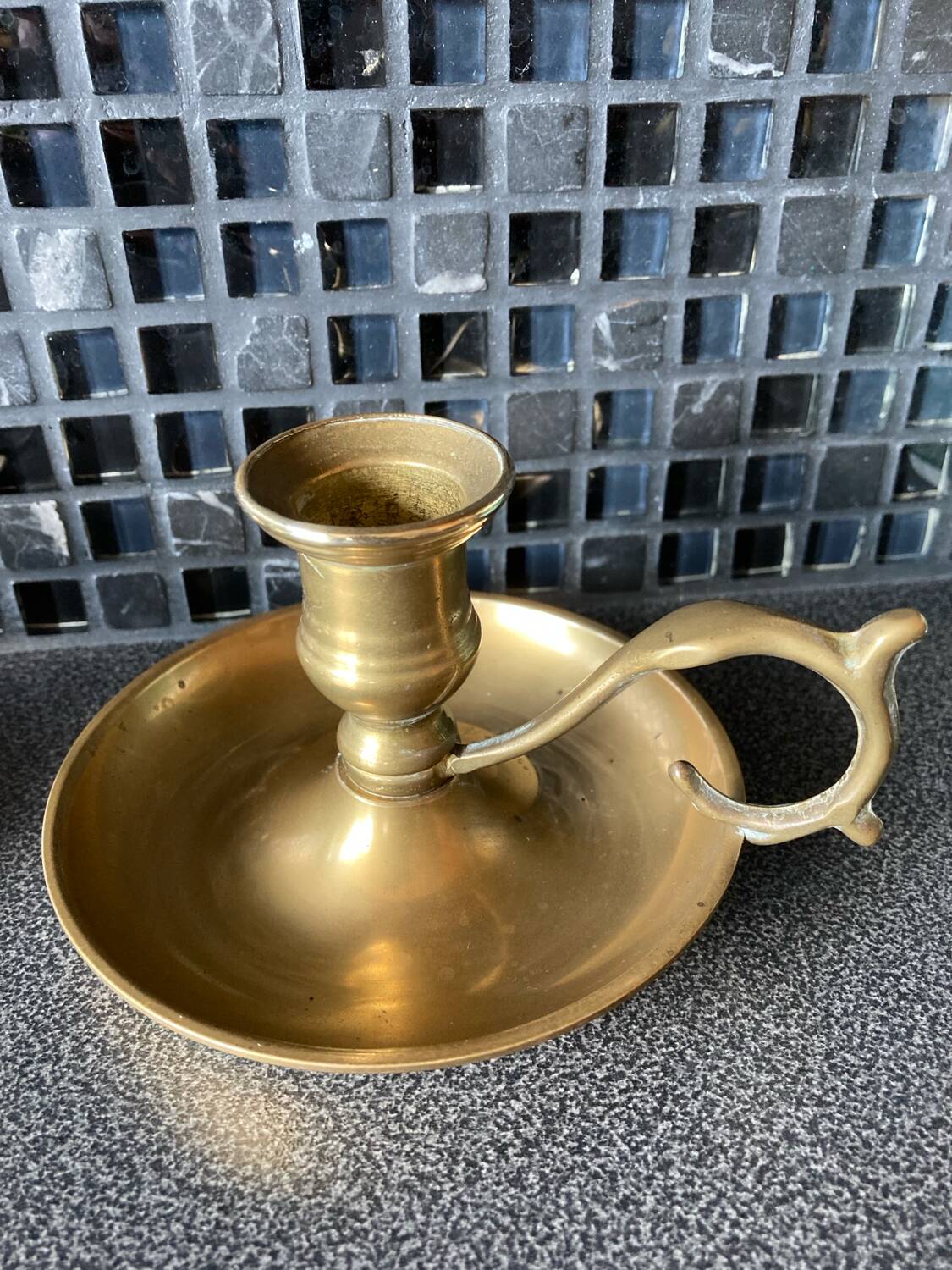 Two brass hand candle holders