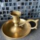 Two brass hand candle holders