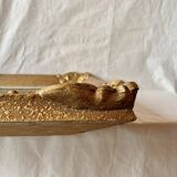 Old wall frame in carved gilded wood