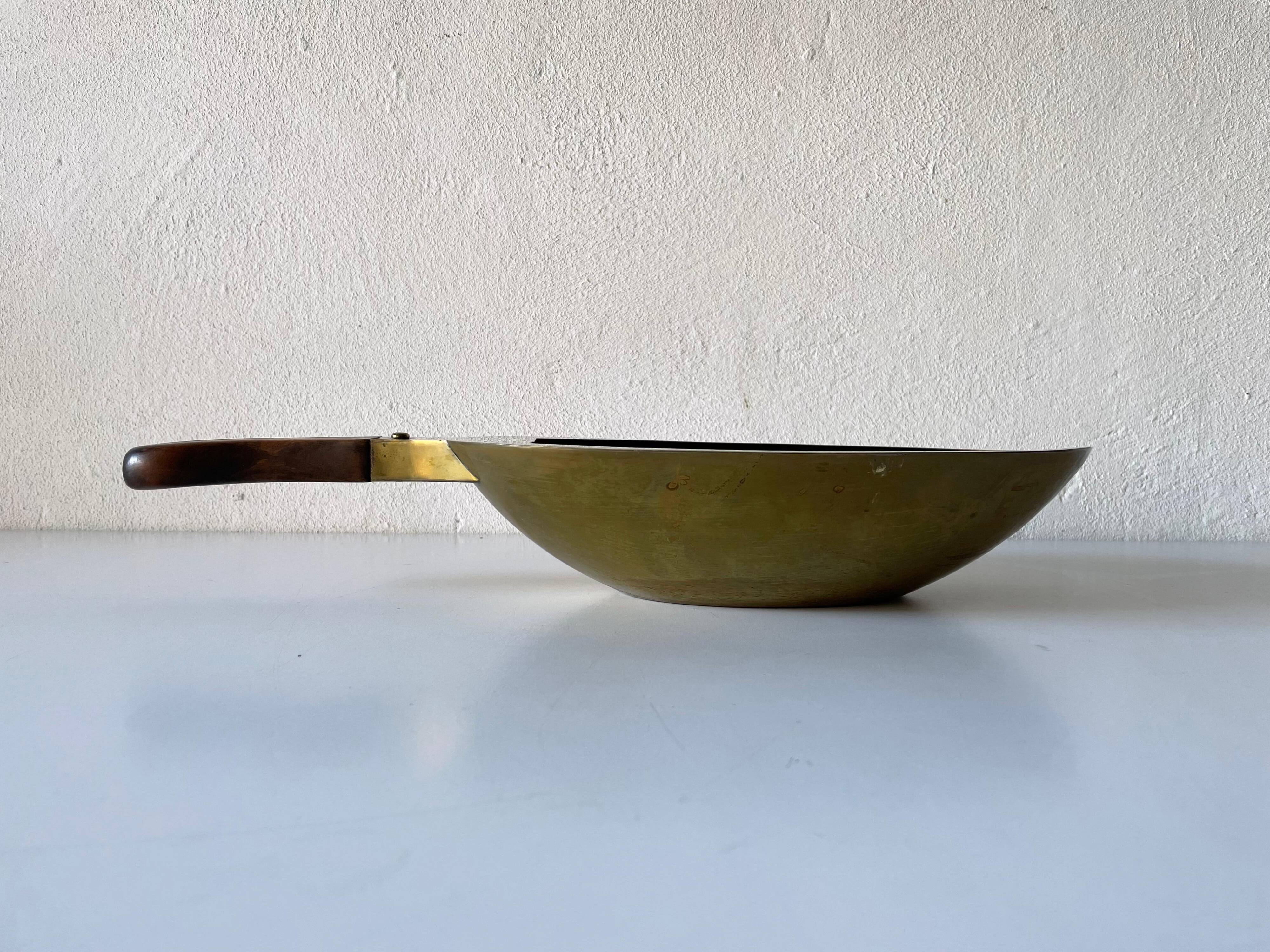 Decorative brass bowl with wooden handle, 1970s, Turin, Italy.