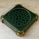 Art Deco bottle coaster in speckled green glazed ceramic and