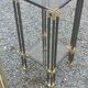 Pair of Hollywood Regency side tables in gold metal and smoked glass.