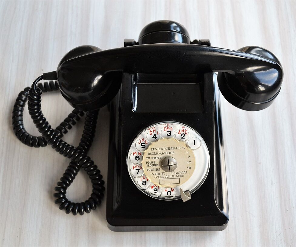 Bakelite dial PTT phone with 1960s vintage earpiece