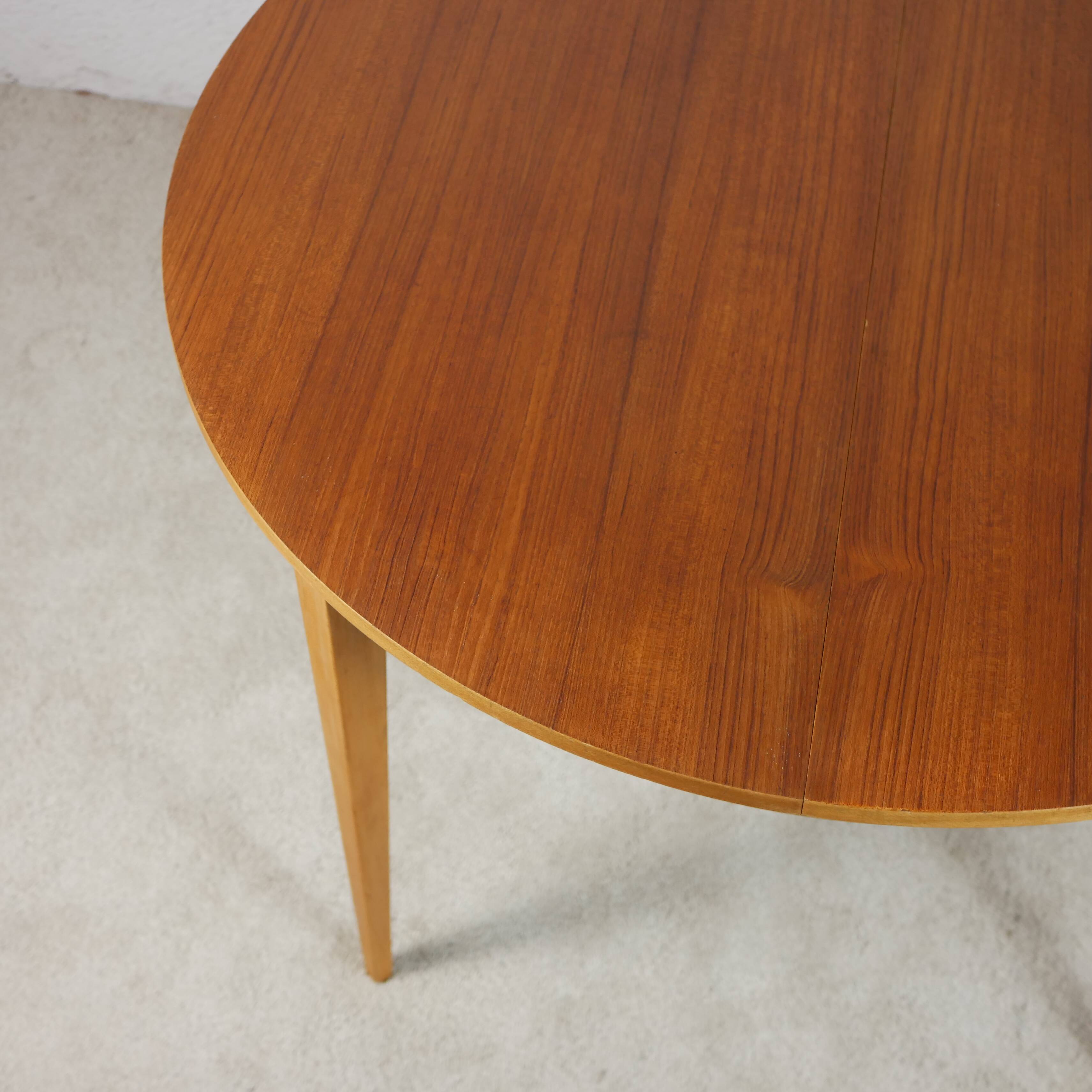 Scandinavian style teak table with butterfly extension