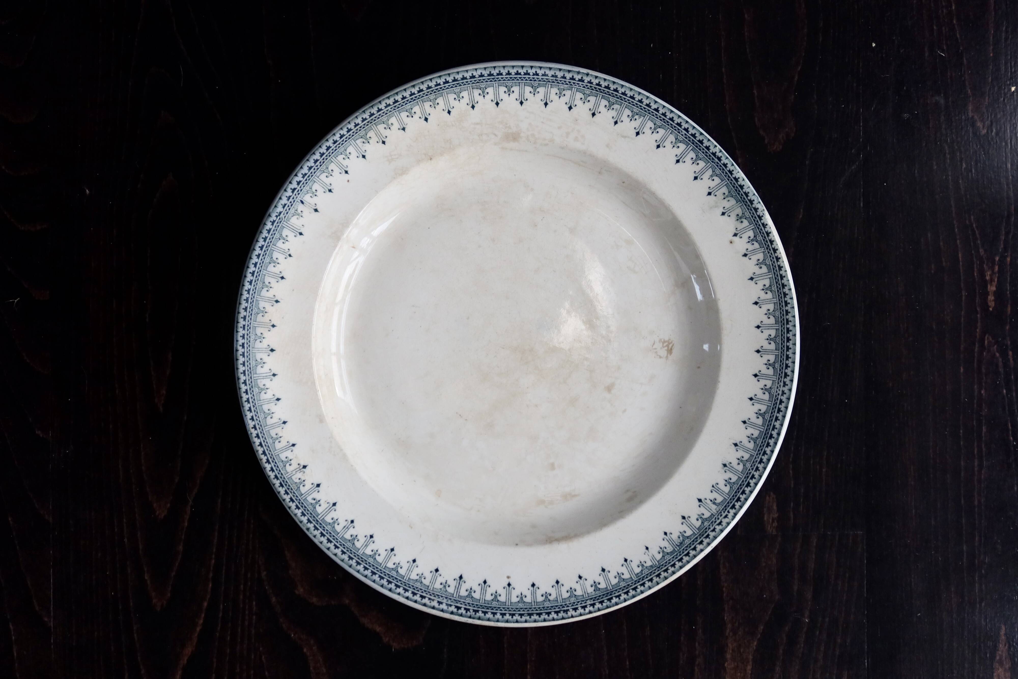 Round vintage patinated ironstone serving dish - Border model
