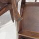 Set of six Italian wooden dining chairs in dark brown faux leather.