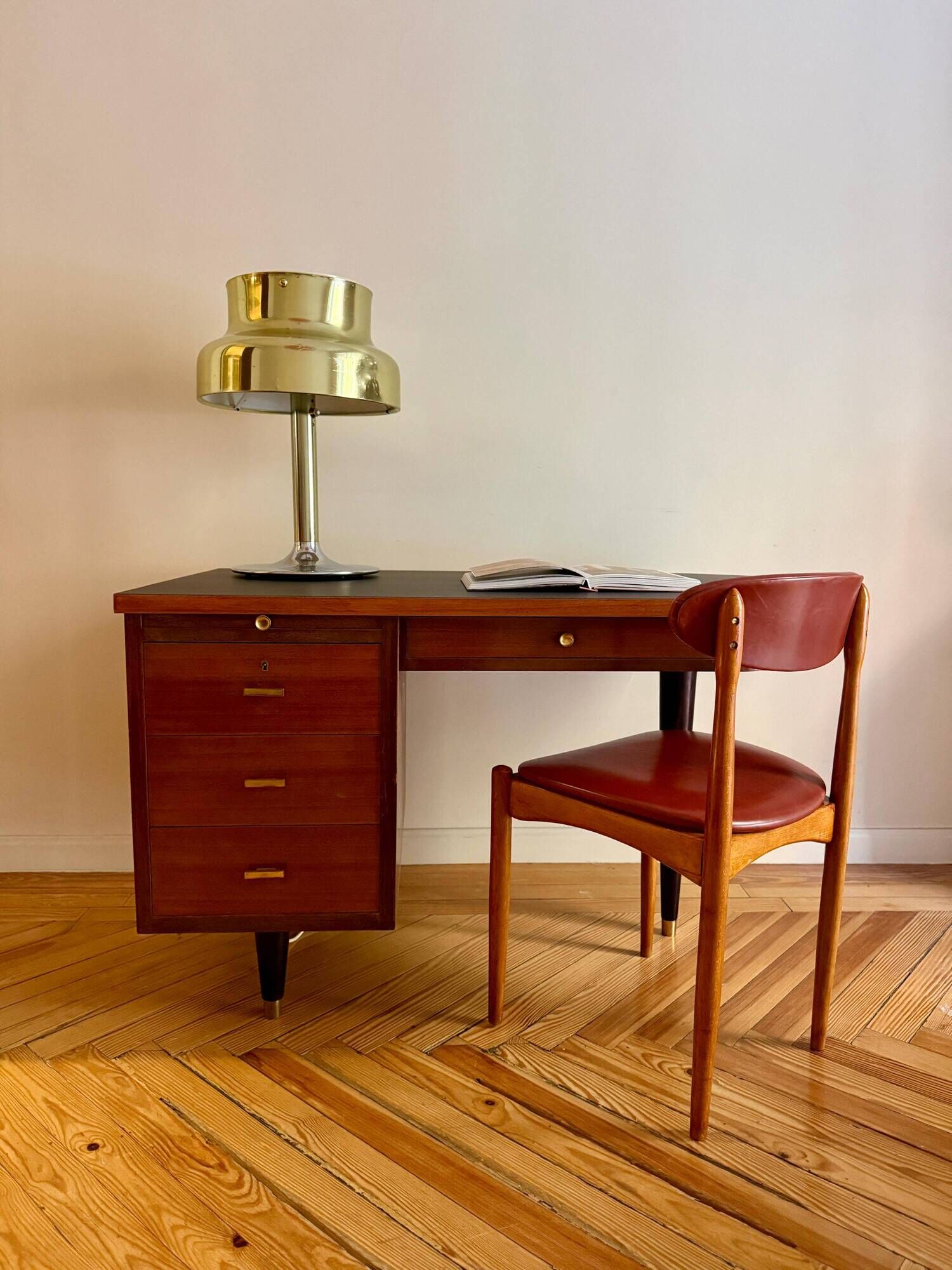 French desk "Prouve" in walnut, bronze and rubber from the 1970s.