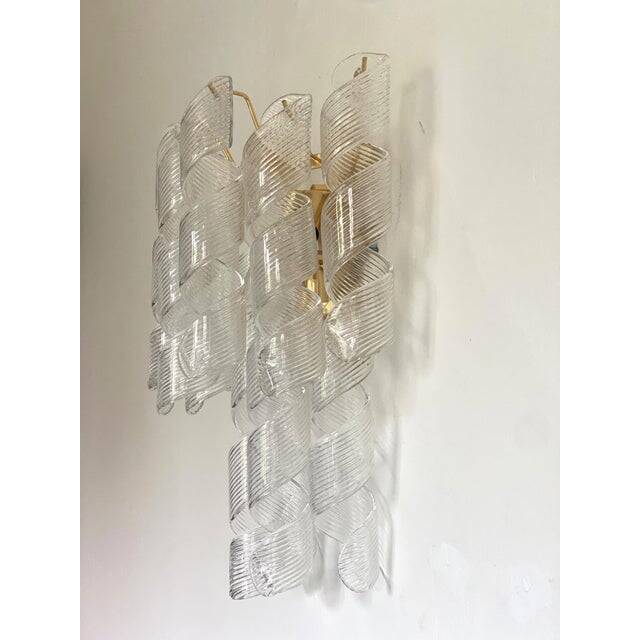 A pair of contemporary transparent “ricci” murano glass wall sconces