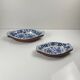 Set of 6 ceramic presentation plates in white and blue, floral pattern with woven wicker frame, 1970s/80s.
