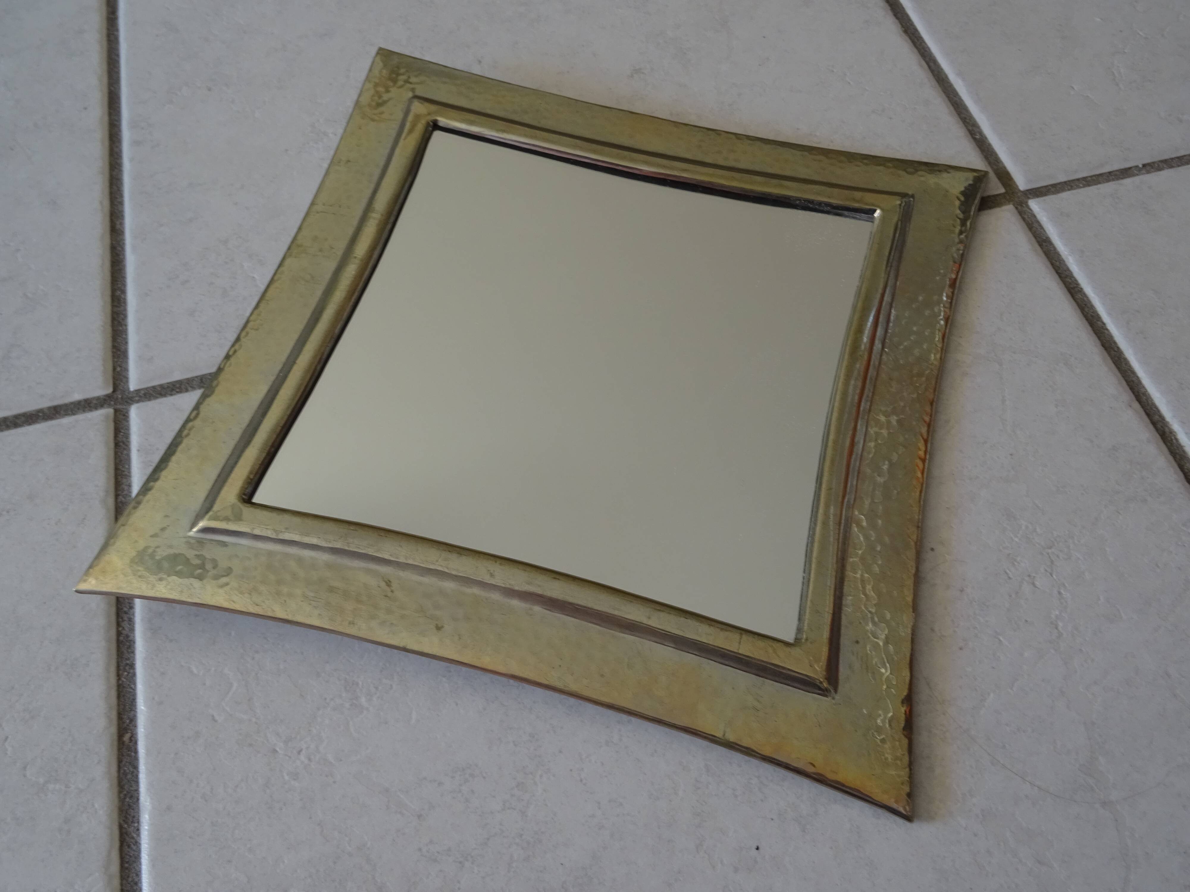 Hammered metal mirror design