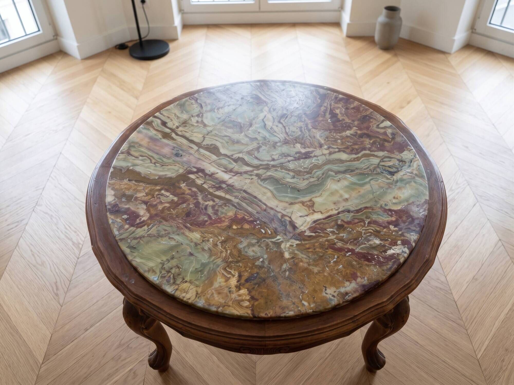 Classic round coffee table in wood with a marble top.