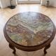 Classic round coffee table in wood with a marble top.