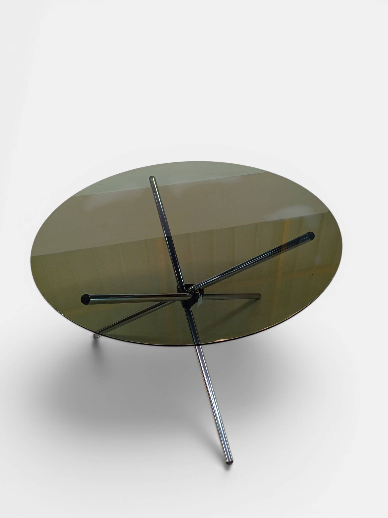 Vintage round table with smoked glass and foldable chrome legs.