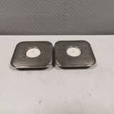 A set of classic Danish candlesticks in polished metal.