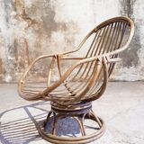 Antique swivel rattan armchair