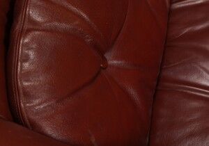 Pair of dark caramel leather armchairs