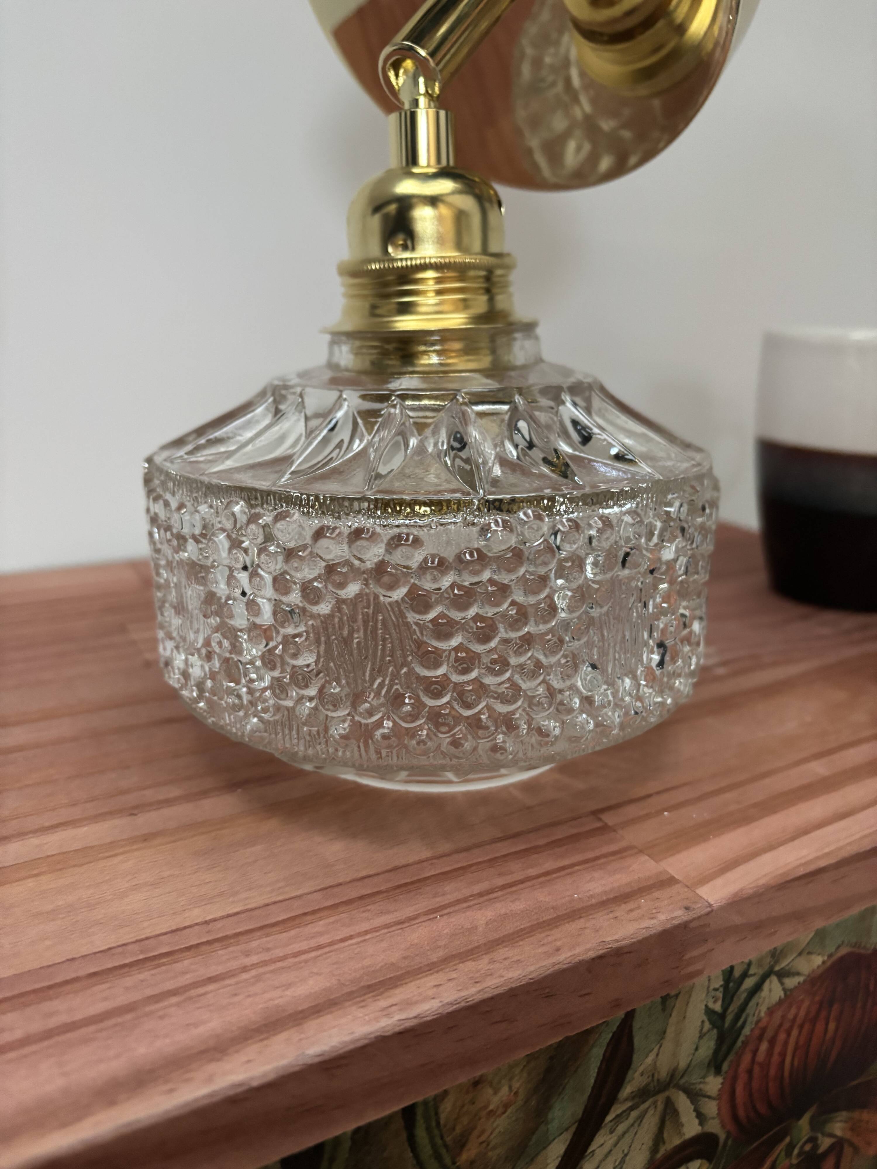 Gold tilting wall light