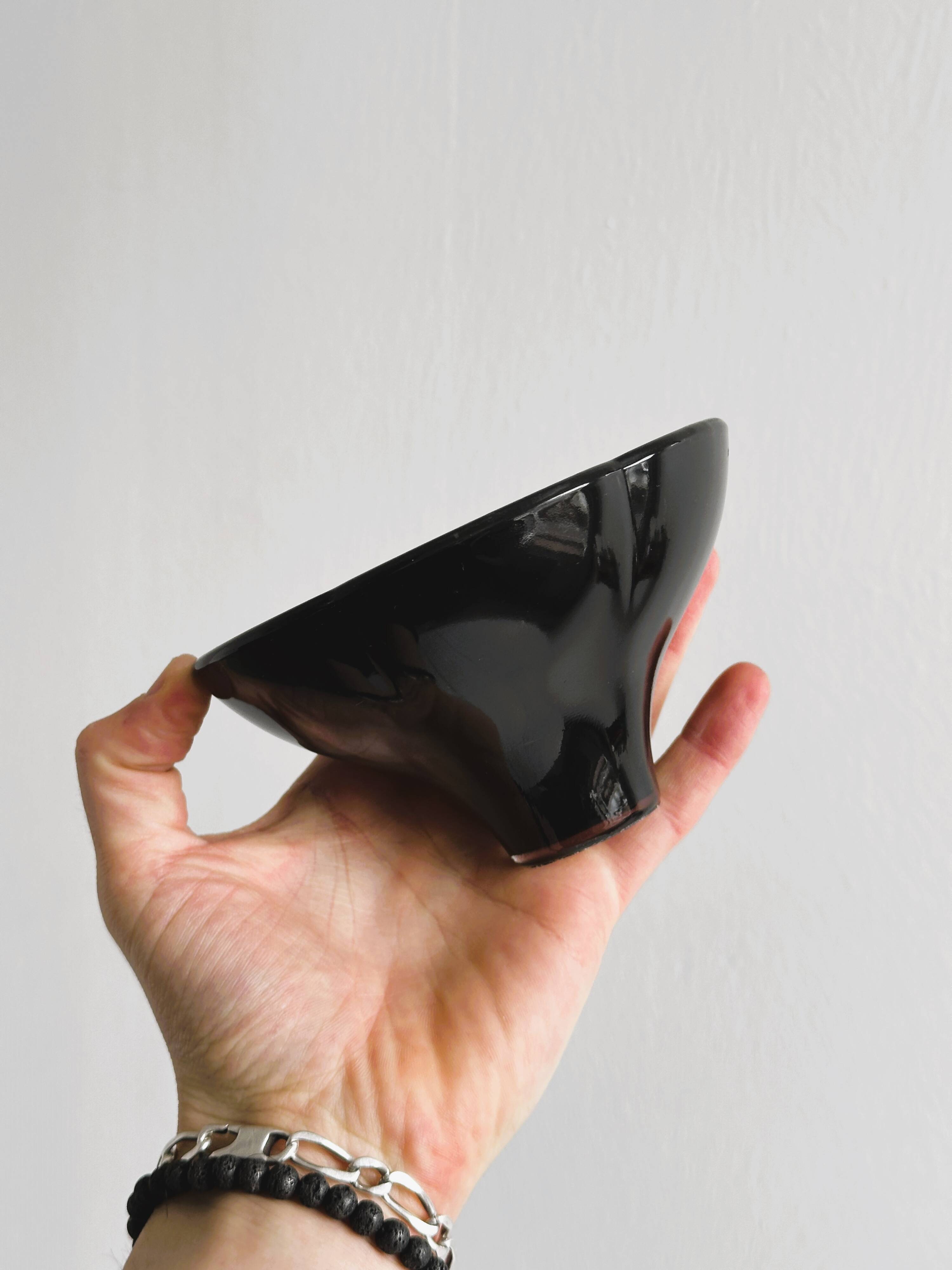Small black glass cup