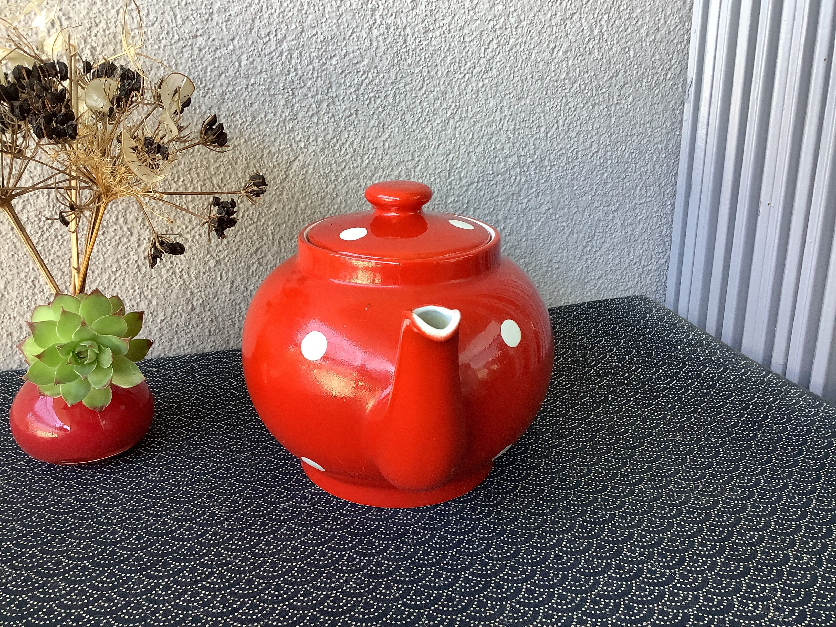 Vintage red teapot with white polka dots