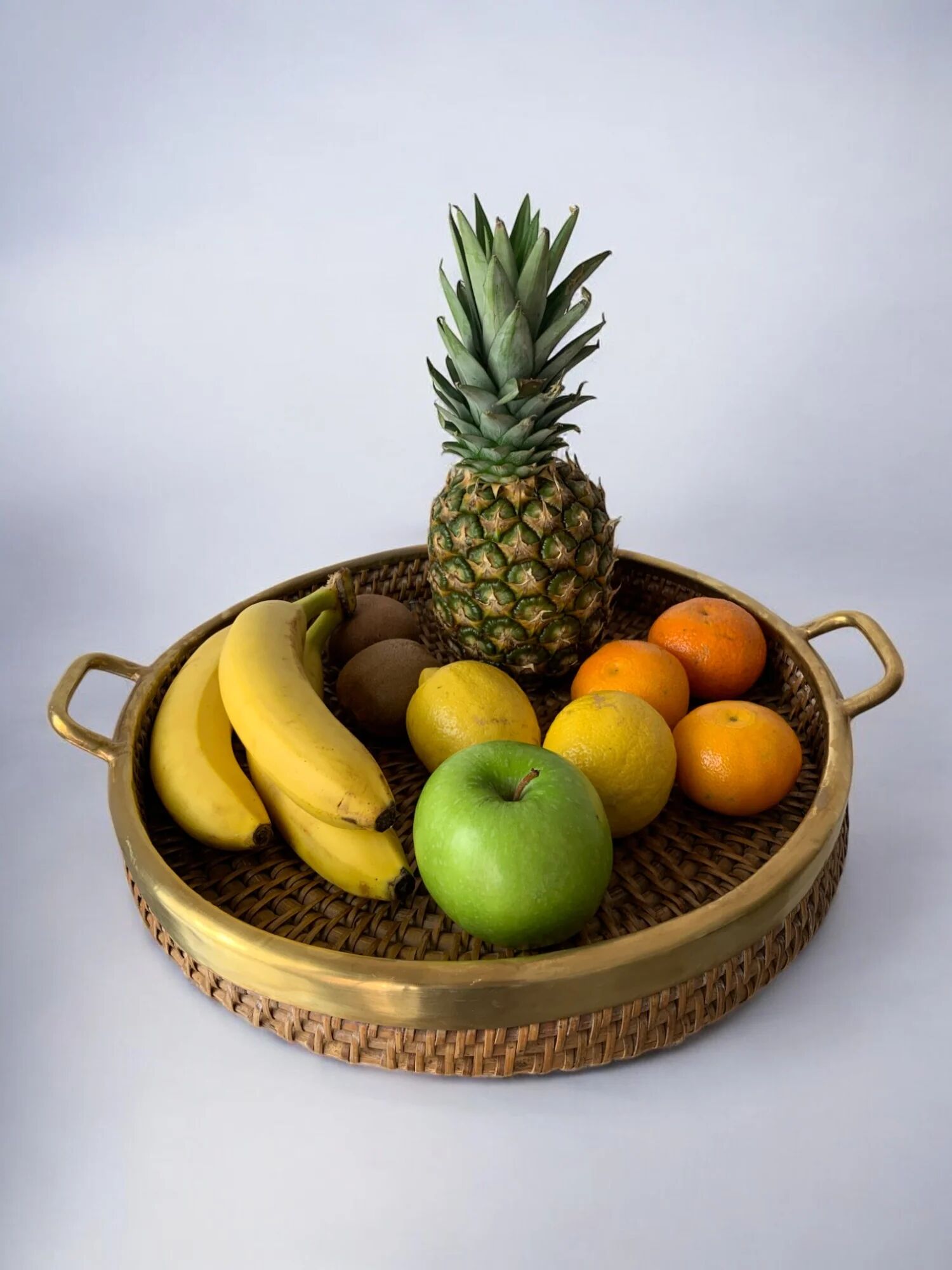 Circular rattan and brass tray, Italy, 1970s, 38 cm diameter