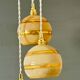 Suspension triple vintage glass globes in frosted yellow and gold.