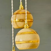 Suspension triple vintage glass globes in frosted yellow and gold.