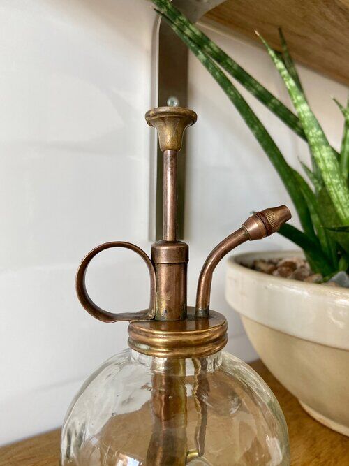 Glass and gold metal spray