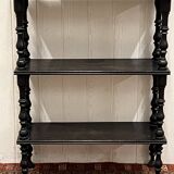 Blackened wooden shelf.