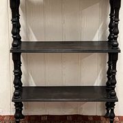 Blackened wooden shelf.