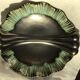 Undulating black iridescent ceramic cut