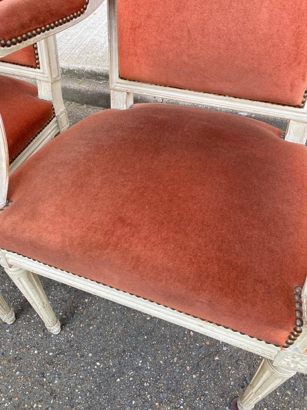 2 Louis XVI armchairs in solid wood and orange velvet.