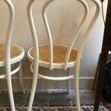 Couple of white bistro chairs